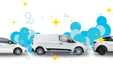 Fleet of vehicles ranging from vans to cars on their way to get a car wash.