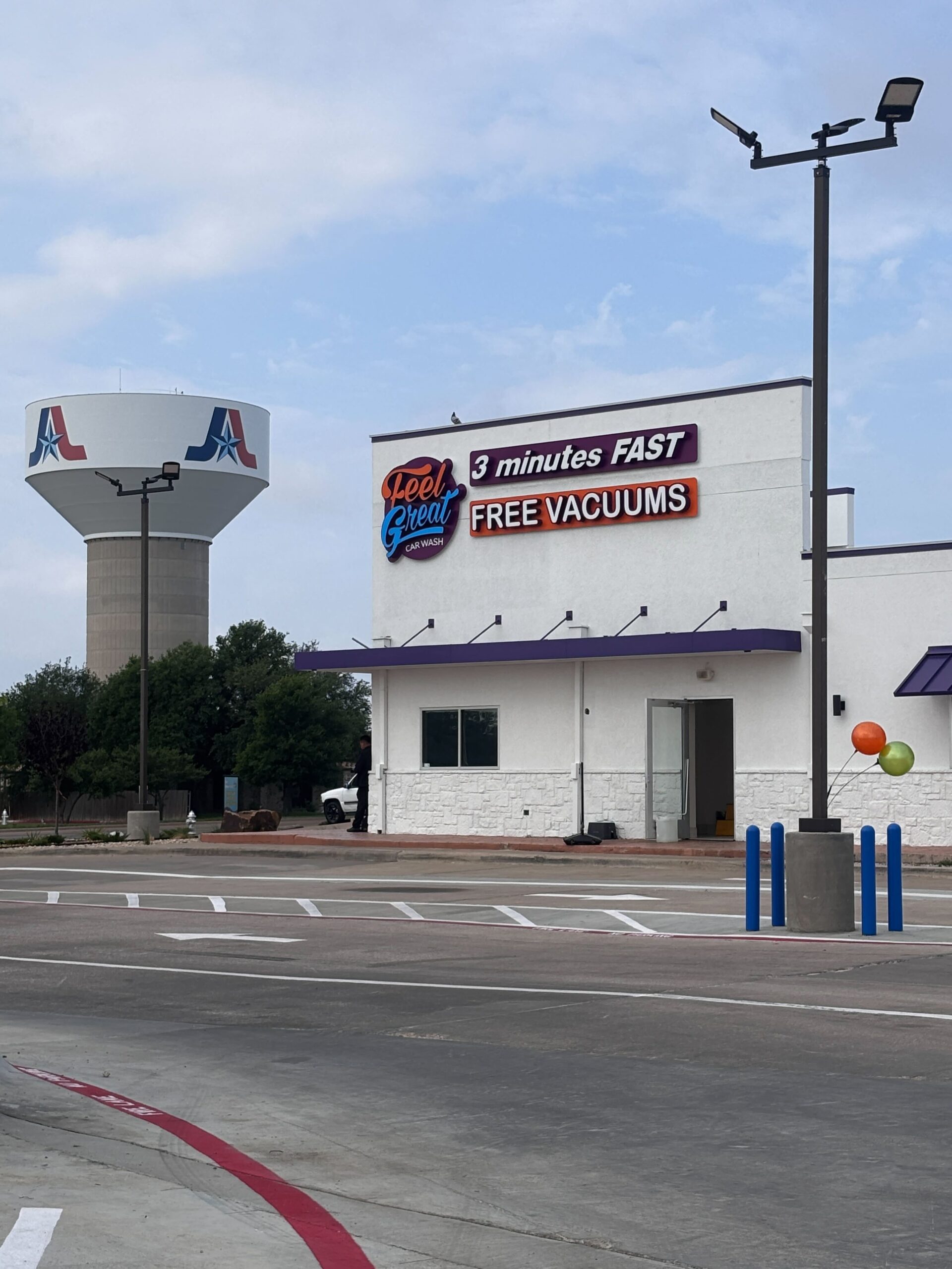 Feel Great Car Wash situated right next to Arlington Water Tower.
